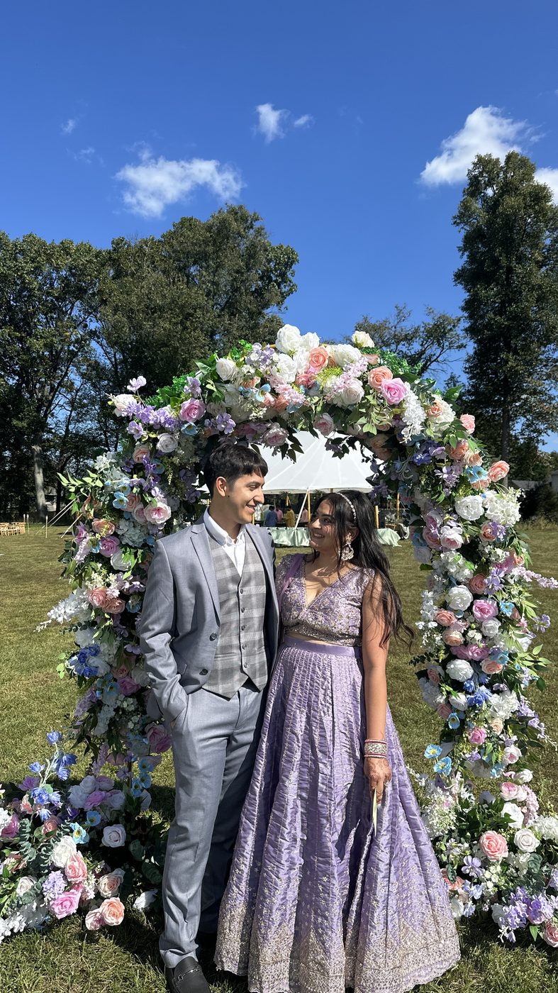 Under a floral arch