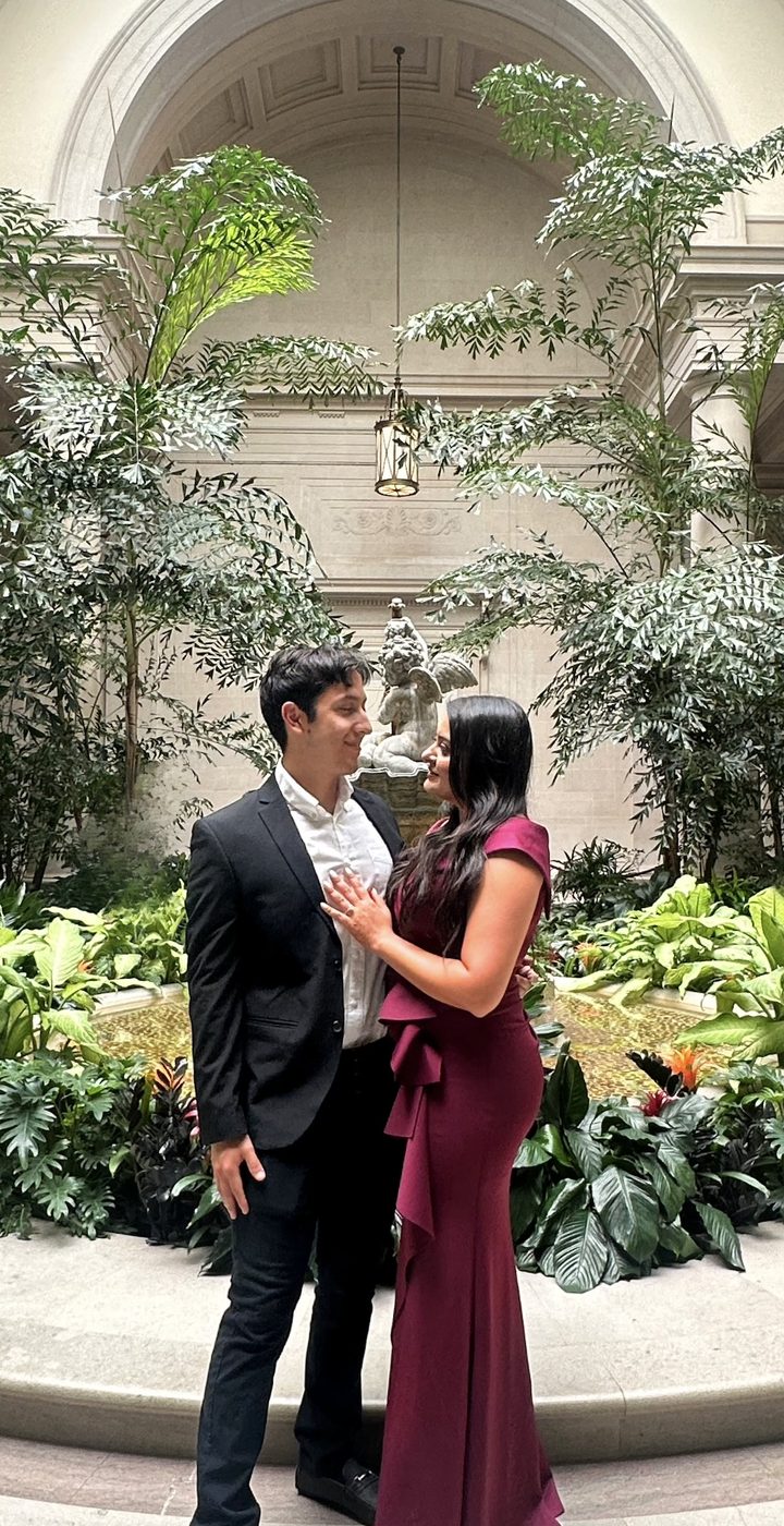 Engagement photo in a garden courtyard